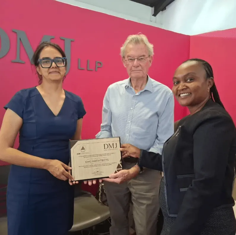DMJ Architects receiving a plaque of recognition from AAK at the DMJ office